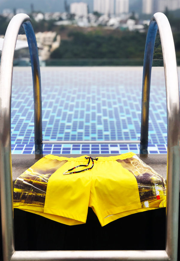 HKG Yellow - Summer-ready with our eco-friendly ‘HKG’ beach shorts - inspired by NYC and Hong Kong skylines!